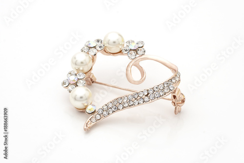 brooch heart with diamonds and pearls isolated on white