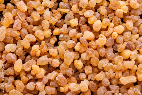 frankincense essential oil on a wooden background