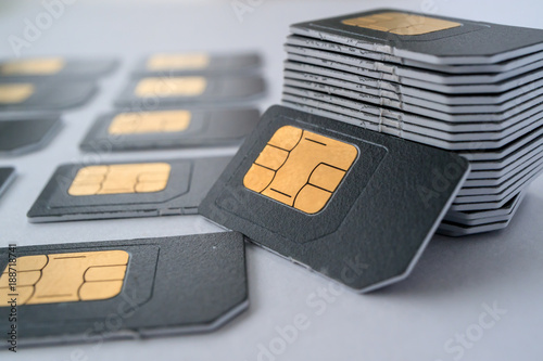 SIM cards for mobile phones in one stack leaning against the stack