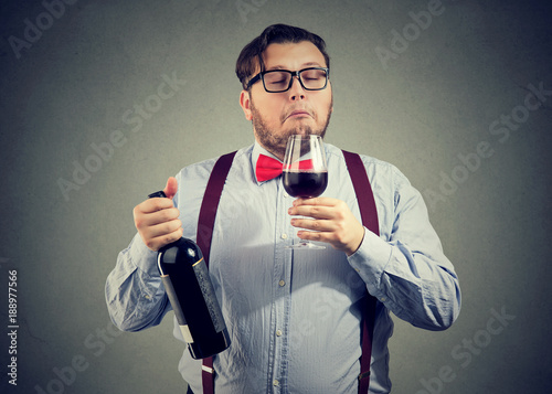 Sommelier smelling wine in glass