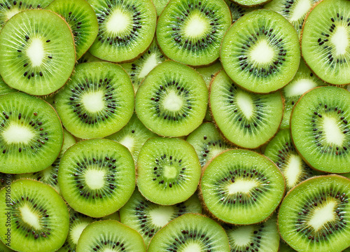 a lot of kiwi slices as textured background
