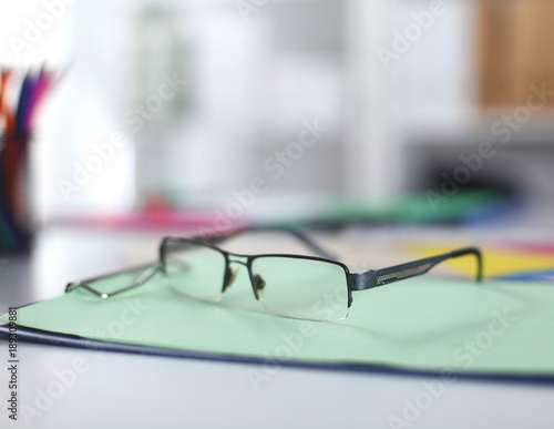 glasses on your desktop. work with drawings. business plan. stapler, magnifier