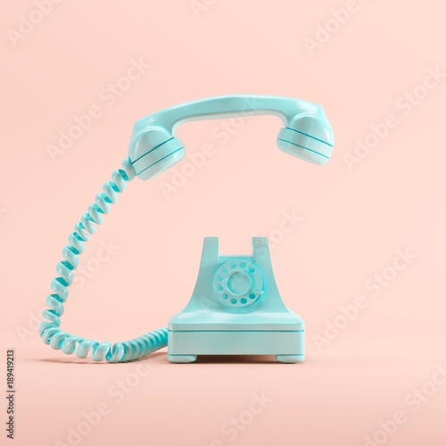 Blue vintage telephone on pink pastel color background. minimal idea concept.