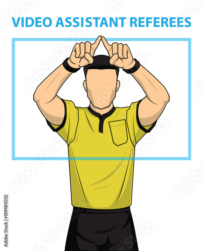 Football referee shows video assistant referees action.