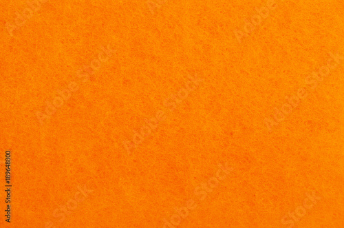 A close up of orange felt material background.