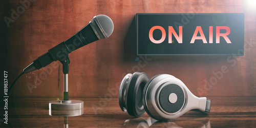 ON AIR written on a black box, headphones and a microphone. 3d illustration