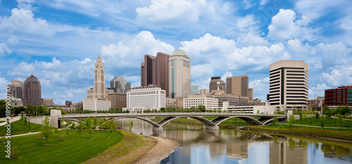 Beautiful skyline of Columbus Ohio with bridge and water reflection