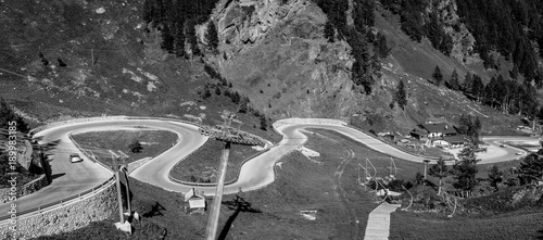 mountain landscape in summer in Trentino Alto Adige. View from Passo Rolle, Italian Dolomites, Trento, Italy. Mountain road - serpentine in the mountains Dolomites, Italy. Image in Black and white