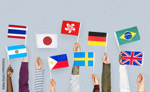 Hands holding a nationality flags