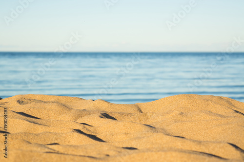 Sunset sand on coast and sea with sky background