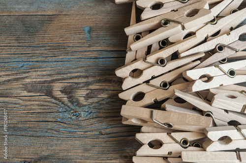 Clothespins on wooden background