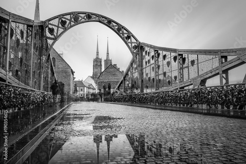 Tumski bridge in Wroclaw with reflection of cathedral