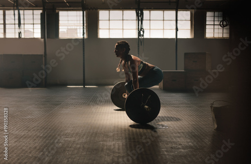 Fitness woman doing weightlifting exercise