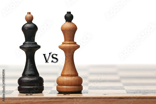 Two chess kings opposite each other on the chessboard. There is "VS" inscription between them and place for text at right side