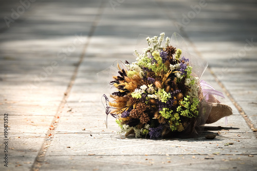 Bouquet on the floor because of disappointment.