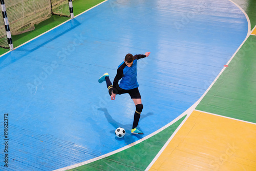 Football goalkeeper on goal, field, Futsal ball field in the gym indoor, Soccer sport field