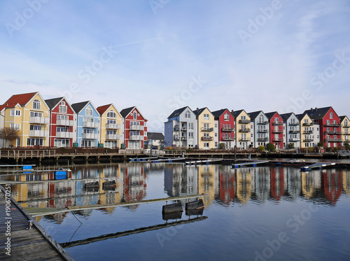 Colorful houses by the cold water and blue sky in Germany
