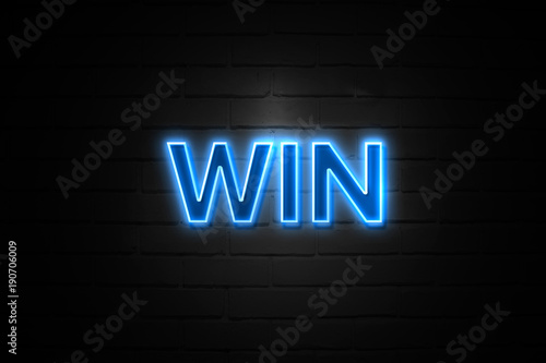 Win neon Sign on brickwall