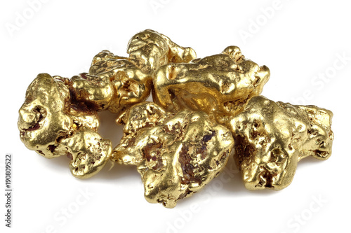 gold nuggets from Alaska isolated on white background