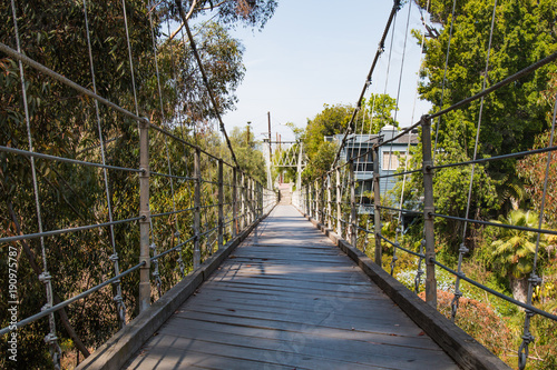 Low angle of the 375 feet long Spruce Street Suspension Bridge in San Diego, California. 
