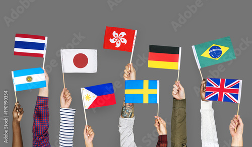 Hands holding international flags