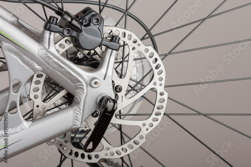 Hydraulic rear disc brake of mountain bike, close up view, studio photo
