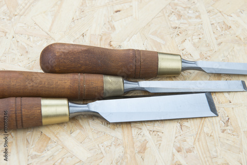 professional chisels on a wooden background