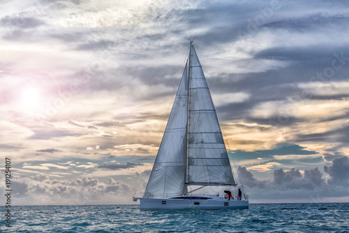 sailboat at sunset in navigation, sail boat