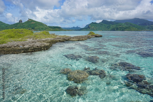 The lagoon with a rocky islet of the island of Huahine near Maroe bay, Pacific ocean, French Polynesia