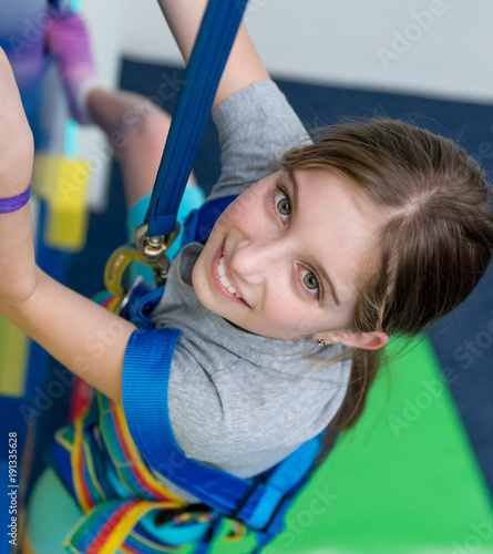 Portrait of teen girl on the climbing wall