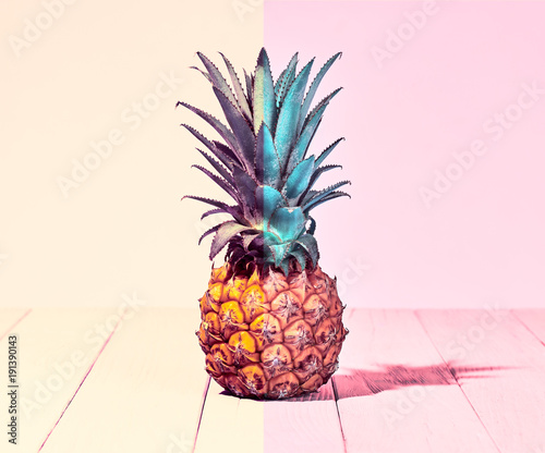 Tropical Pineapple Fruit. Vanilla Pastel Color. Creative Minimal. Hot Summer Vibes. Pink Beach background. Trendy fashion Style. Vintage
