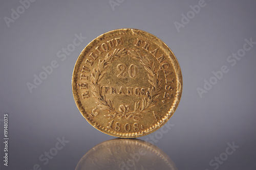 a golden antique coin of the nominal value of 20 francs in 1808 of the Empire France