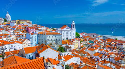 Summertime sunshine day cityscape in the Alfama - historic old district Alfama in Lisbon, Portugal.