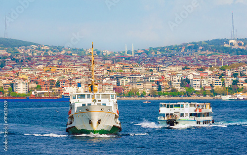 Istanbul cityscape, passenger ferries cross strait of Bosphorus