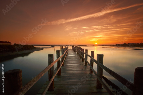 old sea pier at sunrise