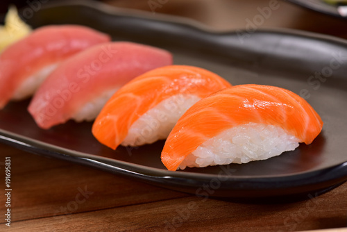 Salmon and Tuna Nigiri Sushis on restaurant table