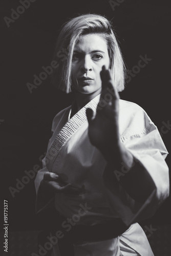 Woman who is exercised practicing karate