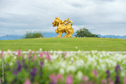 building in garden with bllur flower foreground in singha park , Chiang rai , northern of Thailand