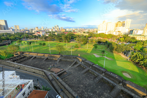 Manila city skyline in Philippines. Ermita and Paco districts seen from Intramuros.