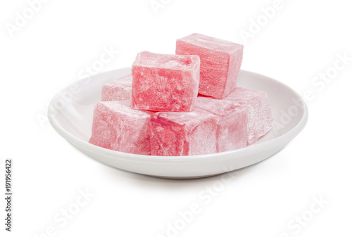 Turkish delight flavored with rose water on the white saucer