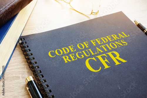 Code of Federal Regulations (CFR) and glasses.