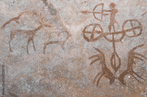 A hunting scene on the wall of the cave. ancient hunters. archeology. era. stone Age.