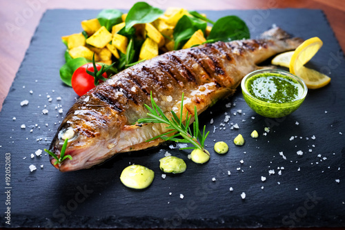 Grilled trout with potato and spinach