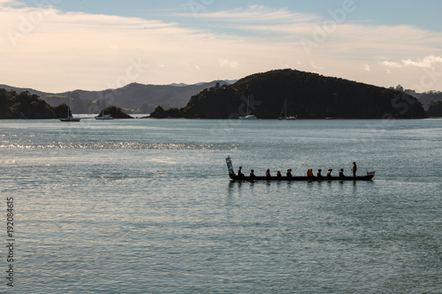 Maori In Waka At Sunrise On Traditional Waitangi Day 