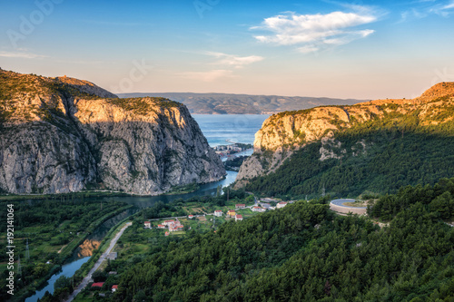 Panoramic view of the canyon and estuary (mouth) of Cetina river, town of Omis and island Brac in Adriatic sea through the rocky Dinara mountains, Croatia