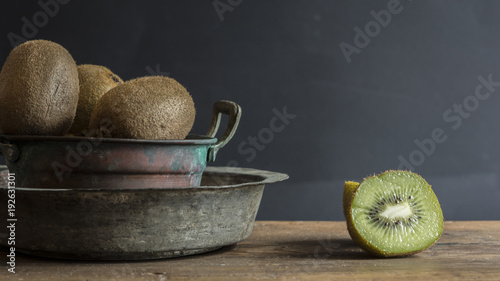 Kiwi fruit on wooden surface