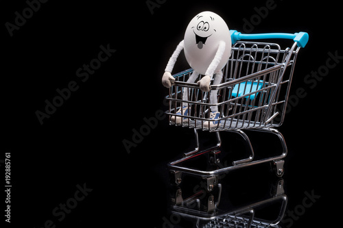 Funny crazy happy egg standing on a cart