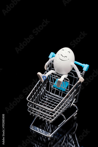 Funny happy egg sitting on a cart
