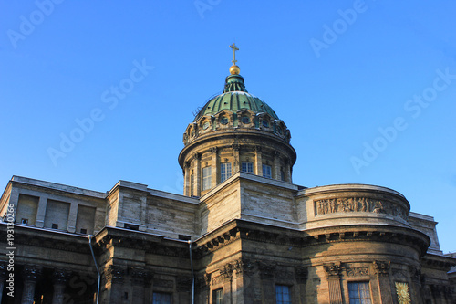 Kazan Cathedral in St. Petersburg, Russia. Orthodox Church Built in 1811 by the Russian Architect Voronikhin. Building Close Up with Dome and Stone Colonnade on Empty Blue Sky Background on Sunny Day.