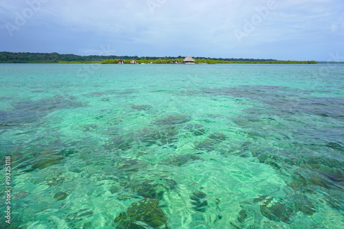 Tropical seascape clear water with a resort on an island in background, Caribbean sea, Bocas del Toro, Panama, Central America